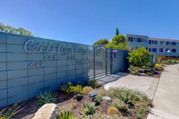 Front view of a residential building with a gated entrance labeled 'Cote D'Azur Villas'.