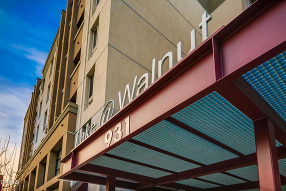 Front view of a multi-story building with distinctive signage.
