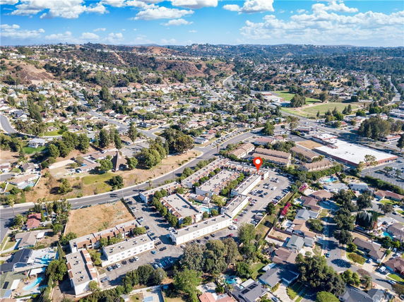 Panoramic view of a suburban area with houses and roads.
