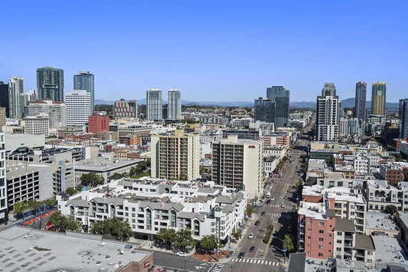 Panoramic view of a cityscape with multiple high-rise buildings.