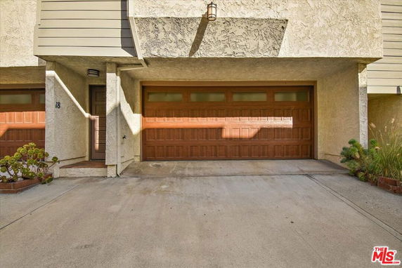 Front view of a house with an attached garage.