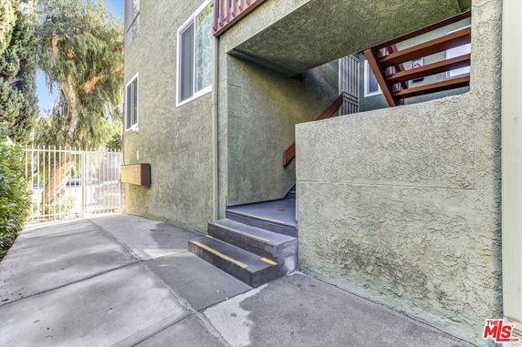 Exterior entrance area with stairs of an apartment building.