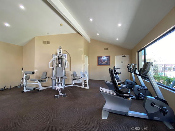 Interior view of a gym area with exercise equipment.