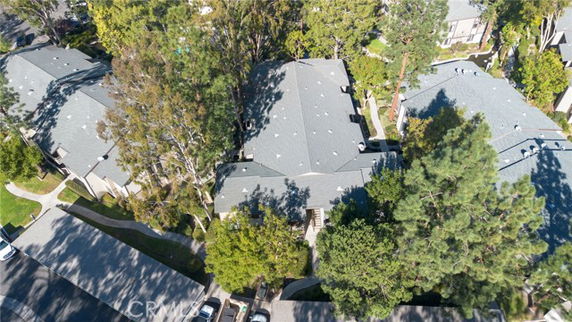 Aerial view of residential buildings surrounded by trees.