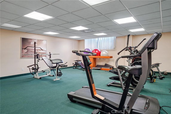 Indoor gym area with exercise equipment and fitness gear.