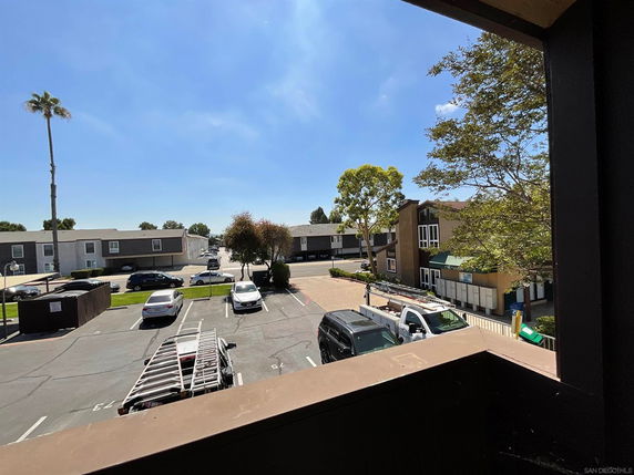 View of parking area and surrounding buildings from a higher vantage point.
