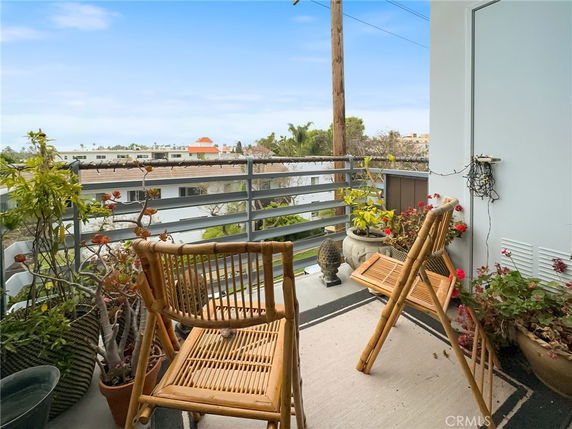 Balcony with chairs and plants overlooking surrounding area
