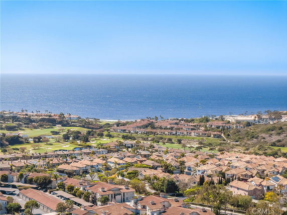 Panoramic view of a coastal residential area with ocean in the background
