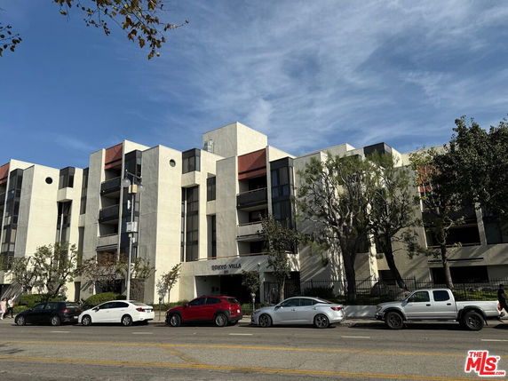 Front view of a multi-story building with a modern design.