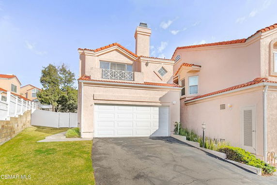 Front view of a two-story house with a double garage.