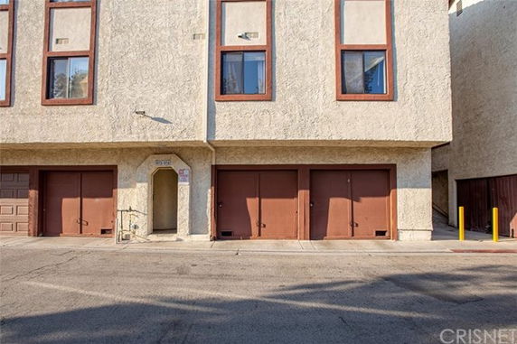 Front view of a building with multiple garage doors.