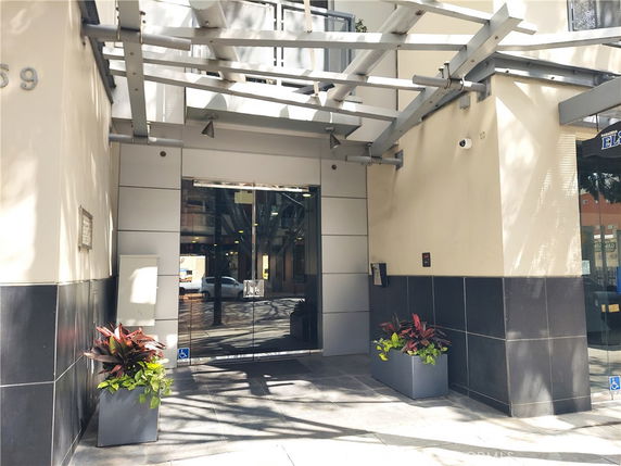 Entrance to a building with glass doors and modern architectural elements.
