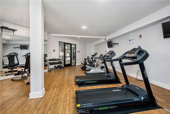 Interior view of a fitness area with treadmills and exercise equipment.