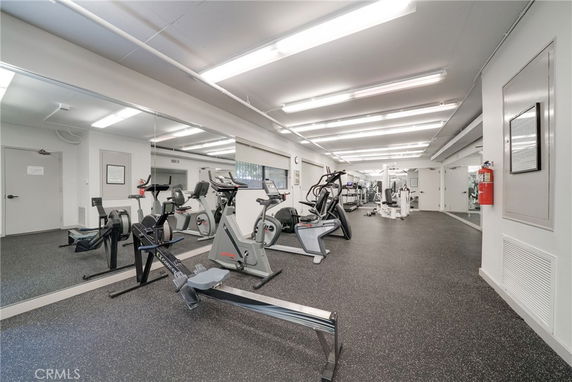 Interior view of a gym with various fitness equipment.