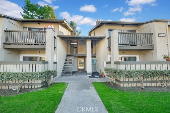 Front view of a two-story residential building with balconies.