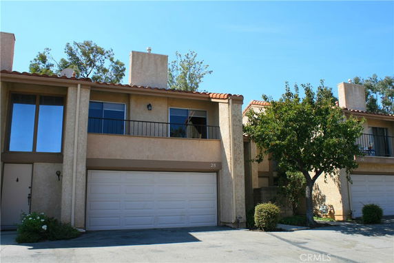 Front view of a two-story house with a double garage.