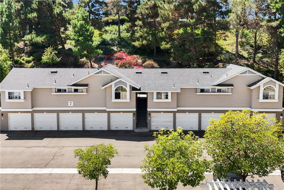 Front view of a multi-garage building with dormer windows.