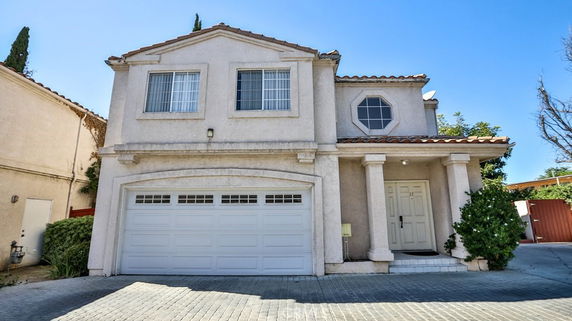 Front view of a two-story house with a double garage.