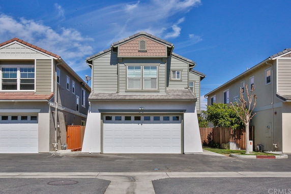 Front view of a two-story house with a garage.
