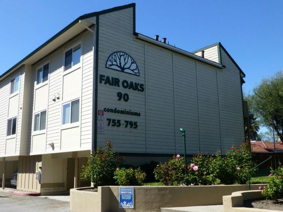 Front view of a multi-story condominium building.