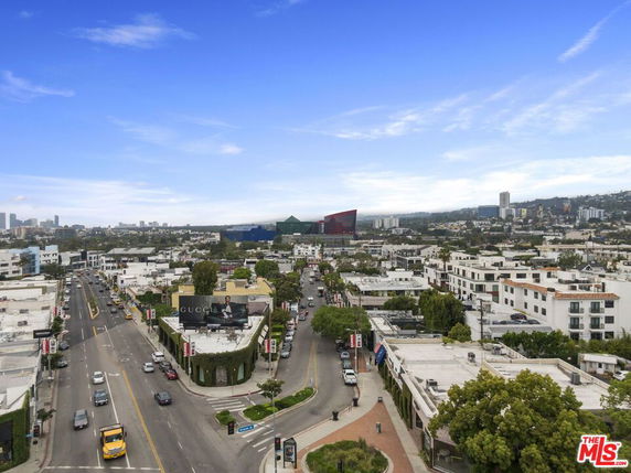 Wide view of a cityscape with streets and buildings.