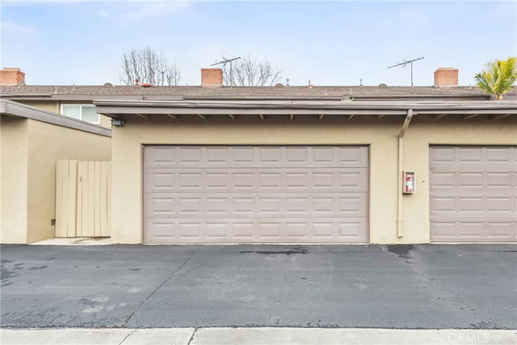 Front view of a building with a double garage entrance.