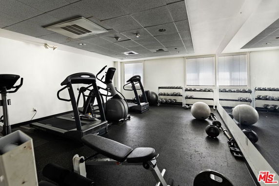 Indoor gym area with exercise equipment.