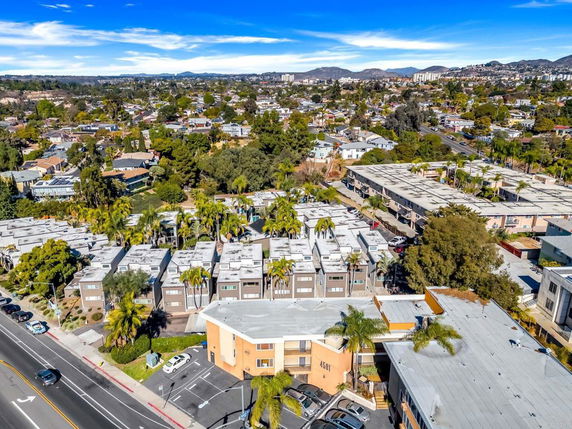 Aerial view of a residential area with multiple buildings and streets.