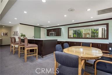 Common area with seating and kitchenette facility.