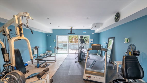 Indoor gym area with fitness equipment and exercise machines.