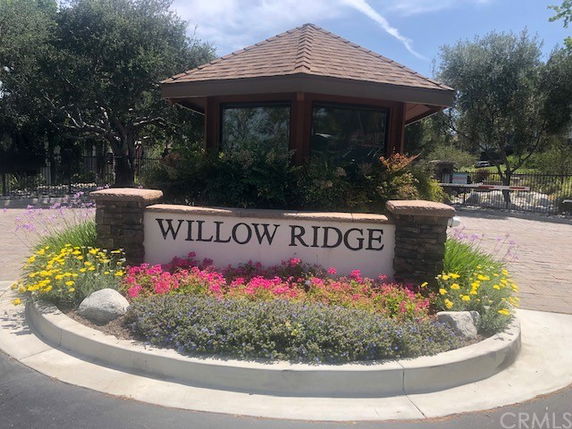 Front view of a building with a sign reading 'Willow Ridge'.