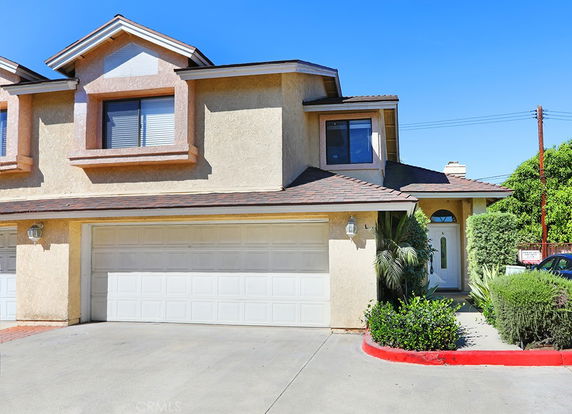 Front view of a two-story house with a double garage.