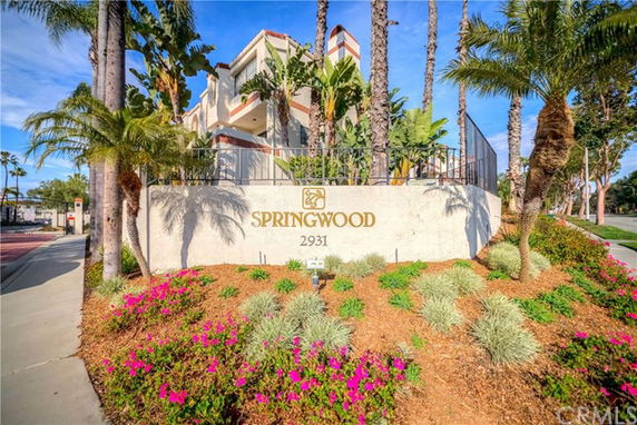 Front view of a building with the 'Springwood' sign and its address.
