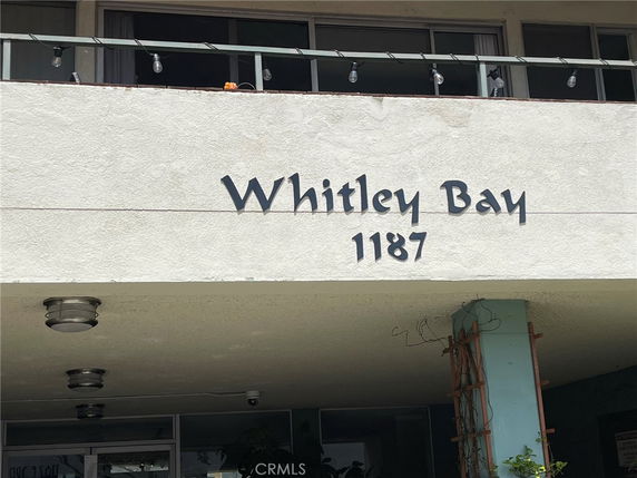 Front view of a building with the name 'Whitley Bay' and number '1187' displayed.