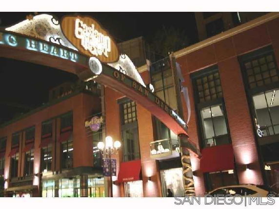 Front view of a commercial building with a prominent entrance archway.