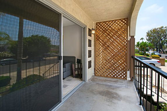 Balcony view showing surrounding residential area.