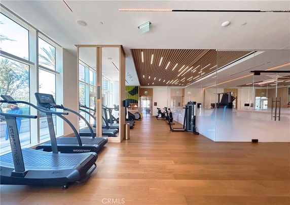 Interior view of a gym area with treadmills and exercise equipment.