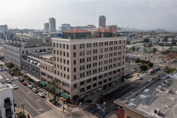 Front view of a multi-story brick building in an urban area