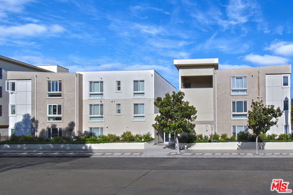 Front view of a three-story apartment building.