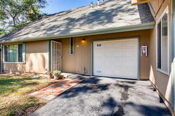 Front view of a single-story house with an attached garage.