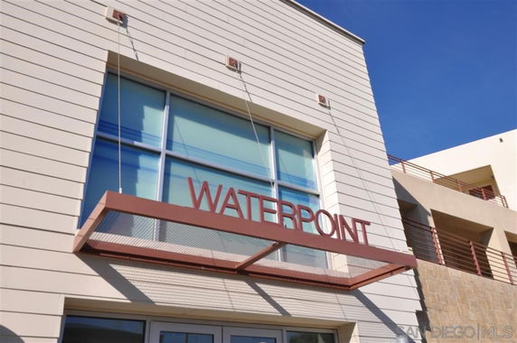 Front view of a modern building with the sign 'Waterpoint'.