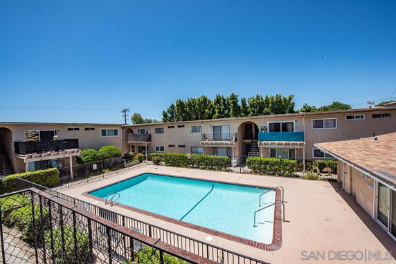 Outdoor swimming pool within an apartment complex.