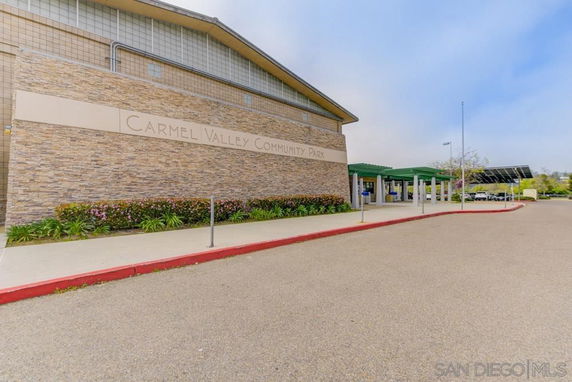 Front view of a community park building with a stone facade.