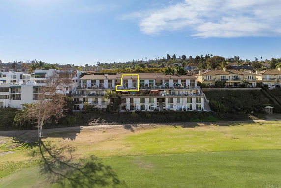 Distant view of residential buildings on a hillside.