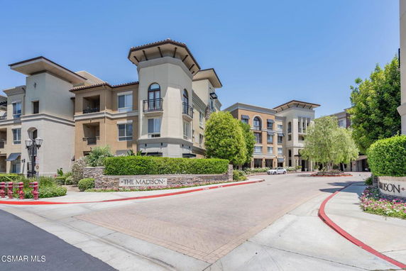 Front view of a multi-story residential complex with modern design.