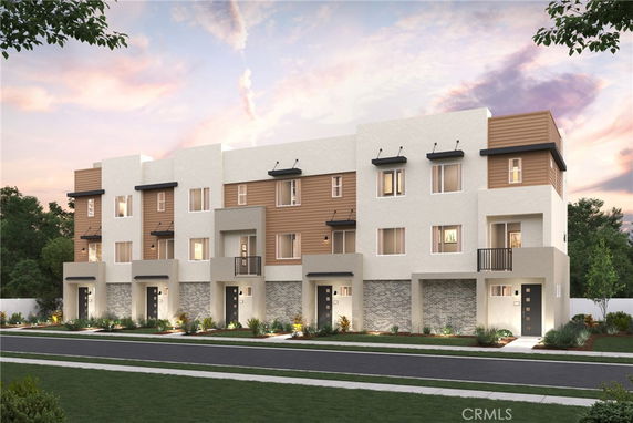 Front view of a modern multi-story townhouse building