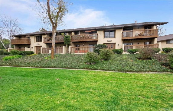 Front view of a two-story residential building with balconies.