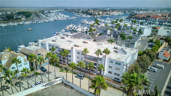 Elevated view of a waterfront residential area with boats on the marina.