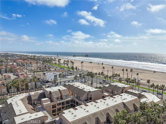 Aerial view of beachfront buildings and ocean.