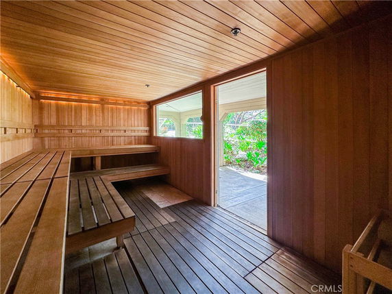 Interior view of a wooden sauna with benches.